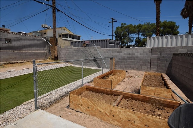 3323 Bancroft Cir, Las Vegas, NV 89121 - fenced backyard featuring a garden