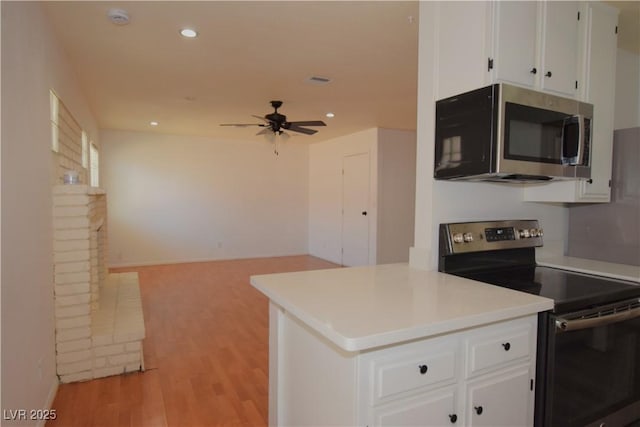3323 Bancroft Cir, Las Vegas, NV 89121 - kitchen featuring stainless steel appliances, white cabinetry, a ceiling fan, light countertops, and recessed lighting