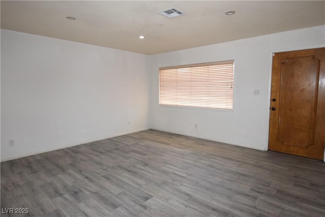 3323 Bancroft Cir, Las Vegas, NV 89121 - unfurnished room featuring wood finished floors and recessed lighting