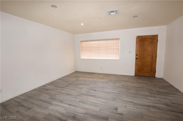 3323 Bancroft Cir, Las Vegas, NV 89121 - spare room with wood finished floors and recessed lighting