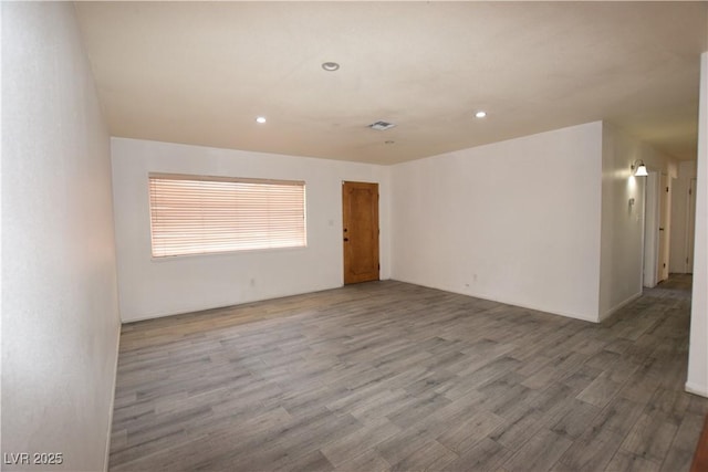 3323 Bancroft Cir, Las Vegas, NV 89121 - unfurnished room featuring wood finished floors and recessed lighting