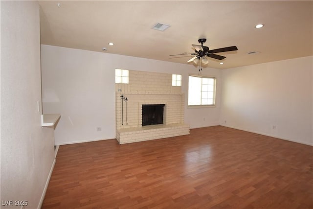 3323 Bancroft Cir, Las Vegas, NV 89121 - unfurnished living room with a ceiling fan, wood finished floors, recessed lighting, and a brick fireplace