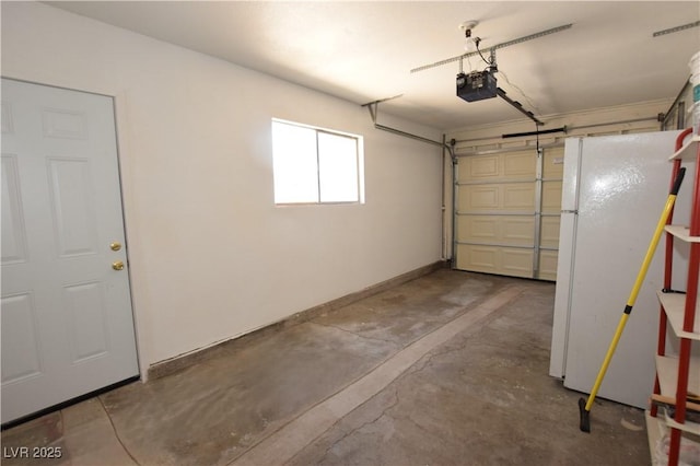 3323 Bancroft Cir, Las Vegas, NV 89121 - garage featuring freestanding refrigerator and a garage door opener