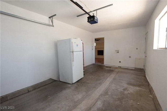 3323 Bancroft Cir, Las Vegas, NV 89121 - garage featuring freestanding refrigerator and a garage door opener