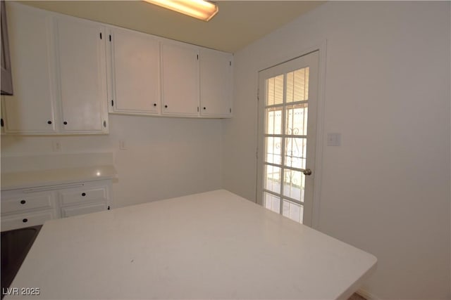 3323 Bancroft Cir, Las Vegas, NV 89121 - kitchen featuring light countertops and white cabinets
