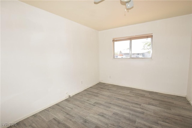 3323 Bancroft Cir, Las Vegas, NV 89121 - unfurnished room with ceiling fan and wood finished floors