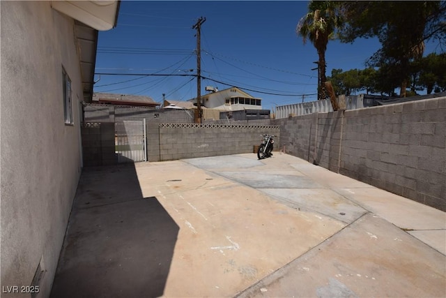 3323 Bancroft Cir, Las Vegas, NV 89121 - fenced backyard featuring a patio area
