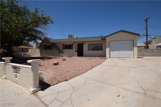 3323 Bancroft Cir, Las Vegas, NV 89121 - single story home featuring concrete driveway, stucco siding, and an attached garage