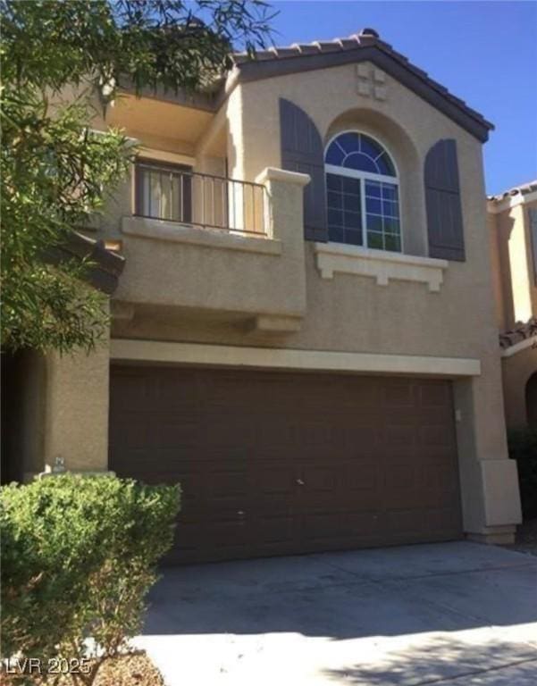 10225 Headrick Dr, Las Vegas, NV 89166 - mediterranean / spanish-style house with an attached garage, stucco siding, a balcony, concrete driveway, and a tile roof