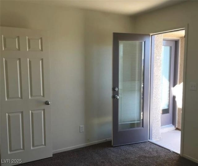 10225 Headrick Dr, Las Vegas, NV 89166 - empty room with dark carpet and baseboards