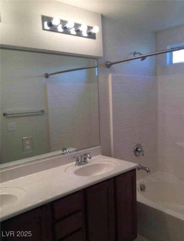 10225 Headrick Dr, Las Vegas, NV 89166 - bathroom featuring shower / washtub combination and double vanity
