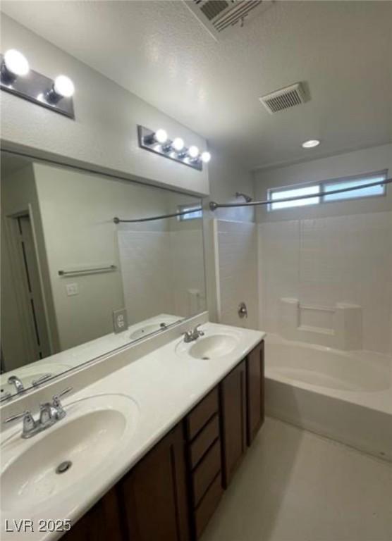 10225 Headrick Dr, Las Vegas, NV 89166 - bathroom featuring tub / shower combination and double vanity