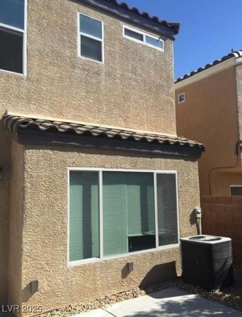 10225 Headrick Dr, Las Vegas, NV 89166 - rear view of house with stucco siding and a tile roof