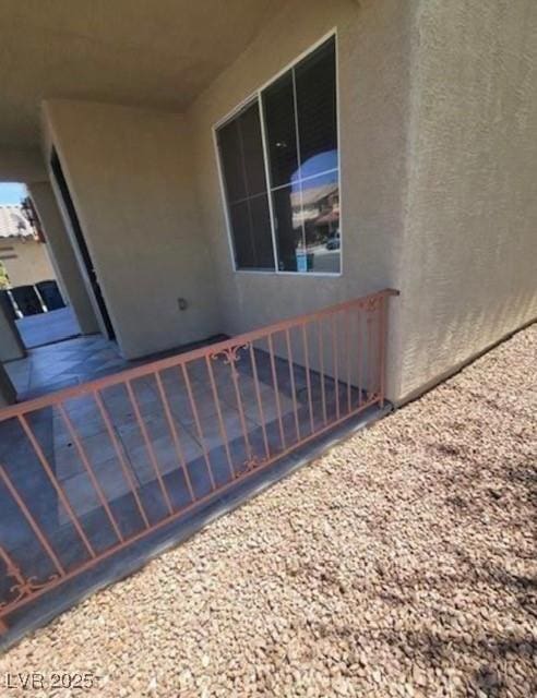 7349 Dolphine Crest Ave, Las Vegas, NV 89129 - property entrance with stucco siding