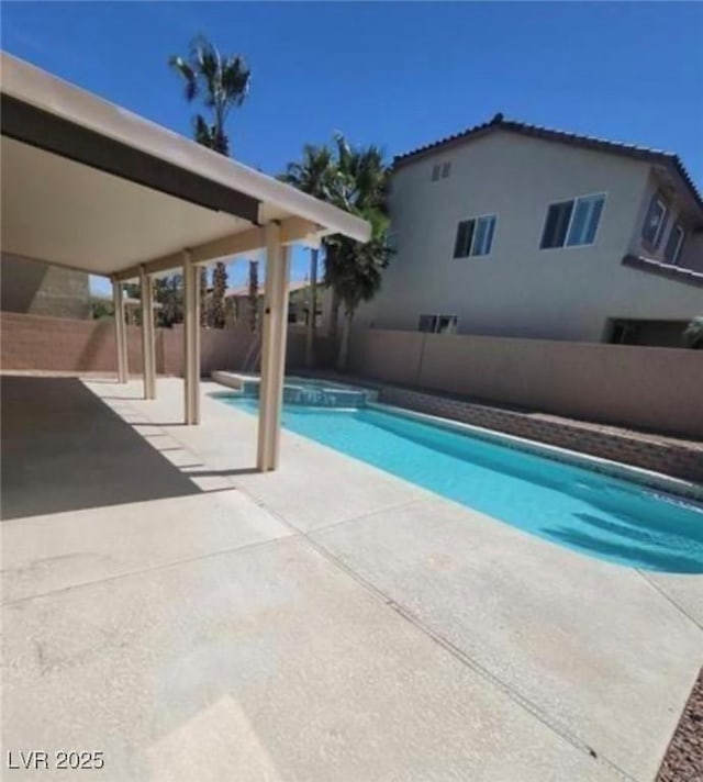 7349 Dolphine Crest Ave, Las Vegas, NV 89129 - view of swimming pool with a patio area, a fenced backyard, and a pool with connected hot tub