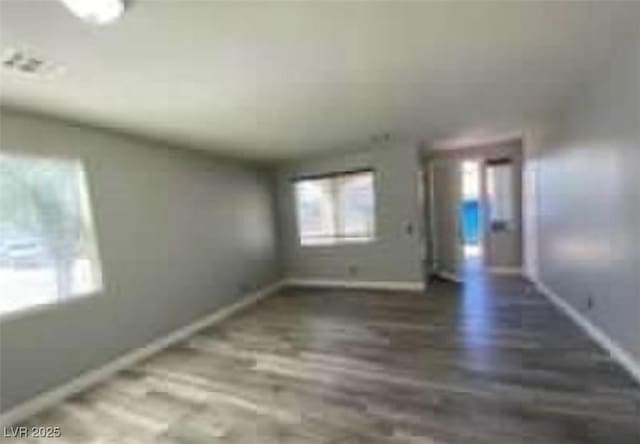 7349 Dolphine Crest Ave, Las Vegas, NV 89129 - empty room with plenty of natural light and wood finished floors