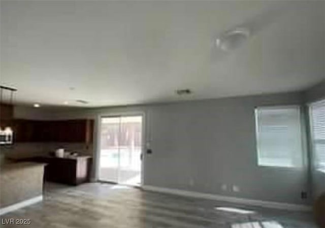 7349 Dolphine Crest Ave, Las Vegas, NV 89129 - unfurnished living room with baseboards