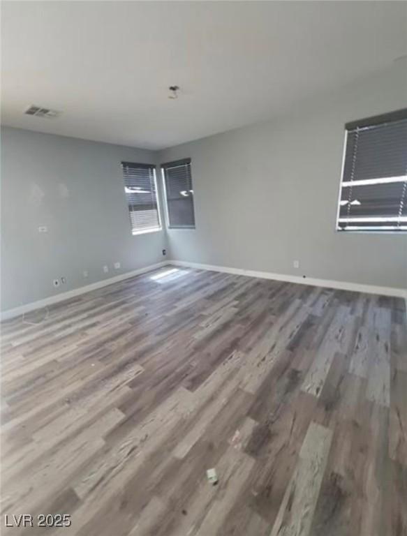 7349 Dolphine Crest Ave, Las Vegas, NV 89129 - unfurnished room with wood finished floors and baseboards