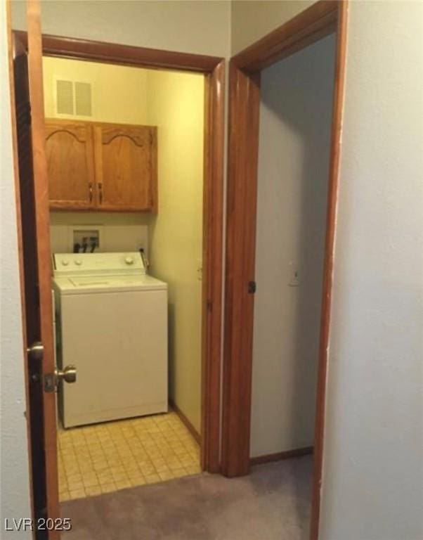 6671 W Tropicana Ave Unit 103, Las Vegas, NV 89103 - washroom featuring washer / clothes dryer and cabinet space