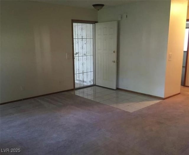 6671 W Tropicana Ave Unit 103, Las Vegas, NV 89103 - carpeted empty room with healthy amount of natural light