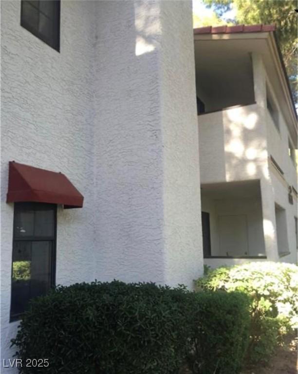 6671 W Tropicana Ave Unit 103, Las Vegas, NV 89103 - view of home's exterior with stucco siding