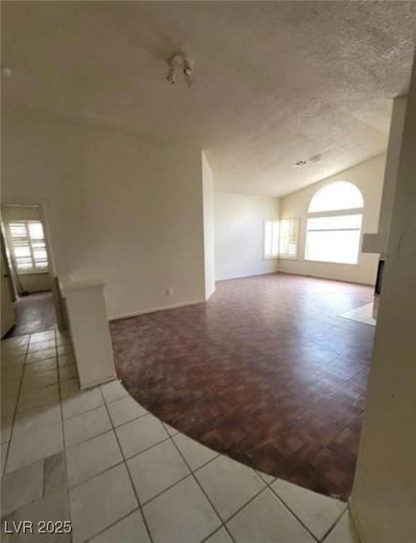 9820 Cross Creek Way, Las Vegas, NV 89117 - spare room featuring healthy amount of natural light, a textured ceiling, and light tile patterned floors