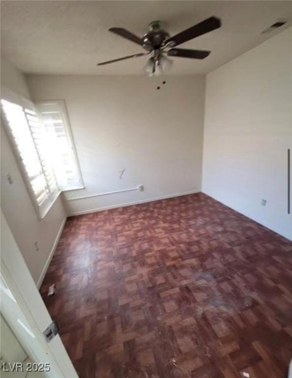 9820 Cross Creek Way, Las Vegas, NV 89117 - spare room with a ceiling fan and baseboards