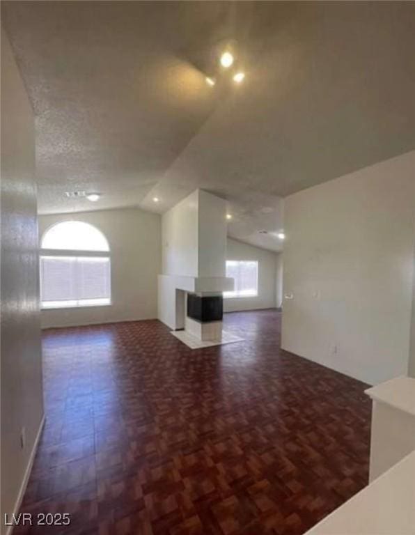 9820 Cross Creek Way, Las Vegas, NV 89117 - unfurnished living room with vaulted ceiling