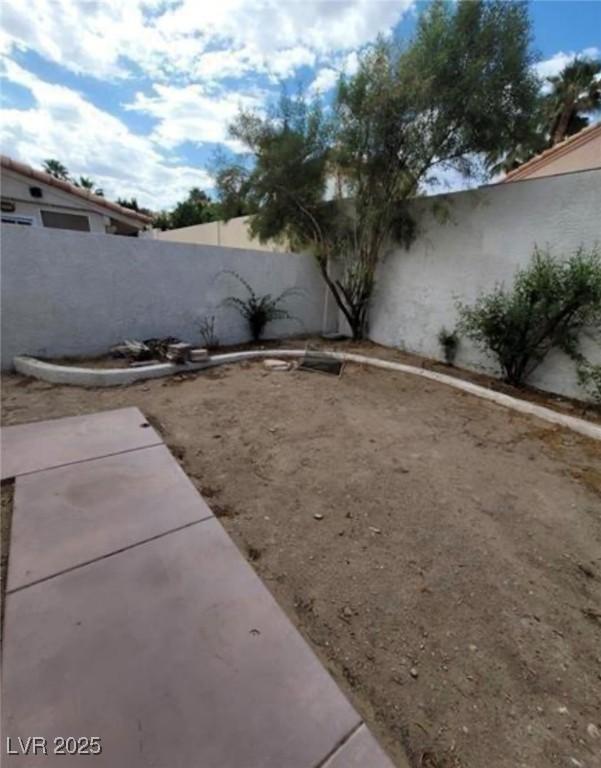 9820 Cross Creek Way, Las Vegas, NV 89117 - fenced backyard featuring a patio