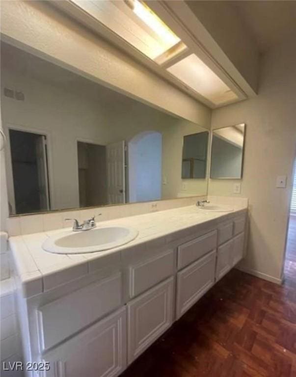 9820 Cross Creek Way, Las Vegas, NV 89117 - bathroom with double vanity and baseboards