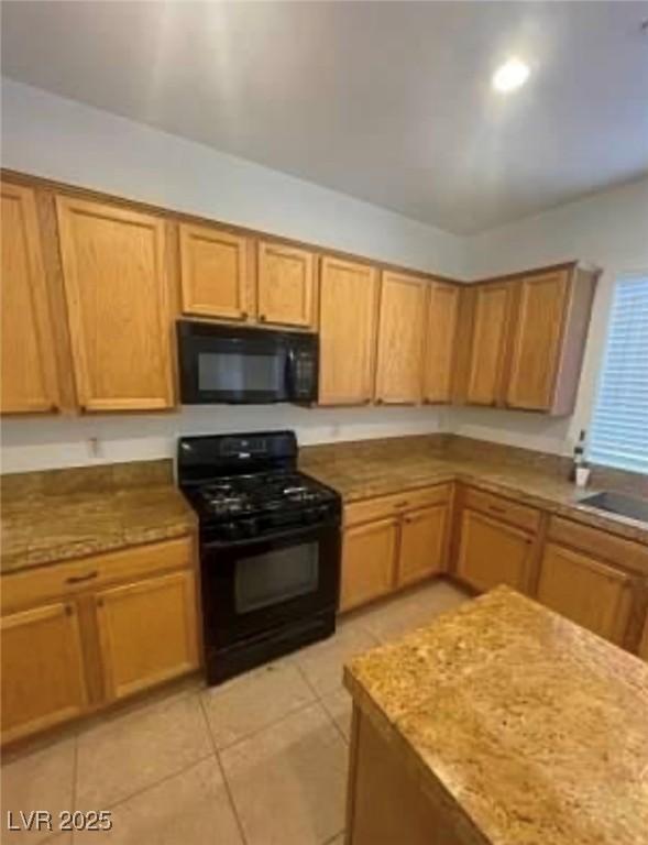 7879 Villa Pintura Ave, Las Vegas, NV 89131 - kitchen featuring black appliances and light tile patterned floors