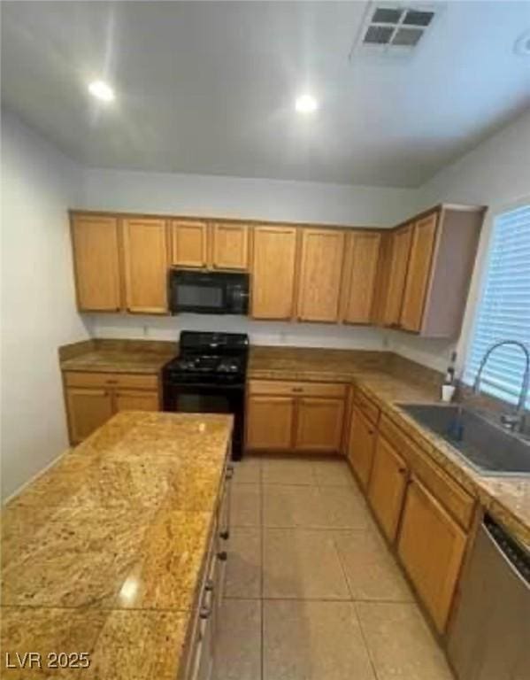 7879 Villa Pintura Ave, Las Vegas, NV 89131 - kitchen featuring black appliances, light countertops, and light tile patterned floors