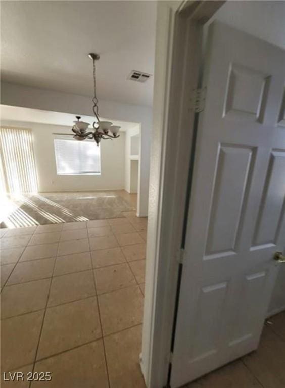 7879 Villa Pintura Ave, Las Vegas, NV 89131 - hall featuring a chandelier and tile patterned flooring