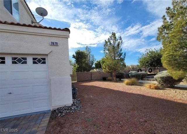 7879 Villa Pintura Ave, Las Vegas, NV 89131 - view of yard with a garage