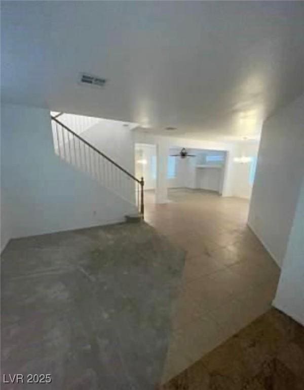 7879 Villa Pintura Ave, Las Vegas, NV 89131 - unfurnished living room with stairway and ceiling fan