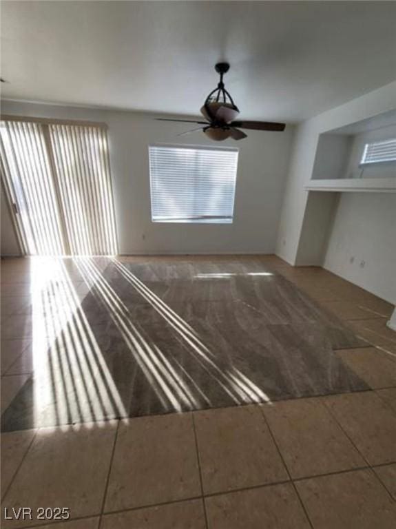 7879 Villa Pintura Ave, Las Vegas, NV 89131 - unfurnished living room with tile patterned flooring and ceiling fan