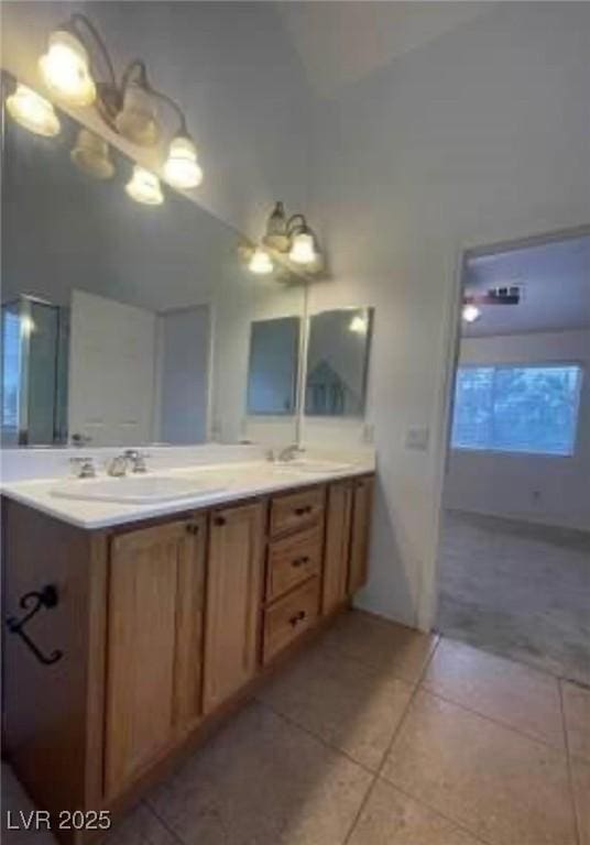 7879 Villa Pintura Ave, Las Vegas, NV 89131 - full bath featuring tile patterned floors, double vanity, and high vaulted ceiling
