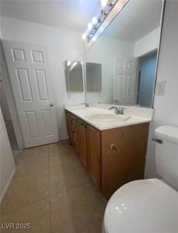 7879 Villa Pintura Ave, Las Vegas, NV 89131 - bathroom featuring double vanity and tile patterned floors