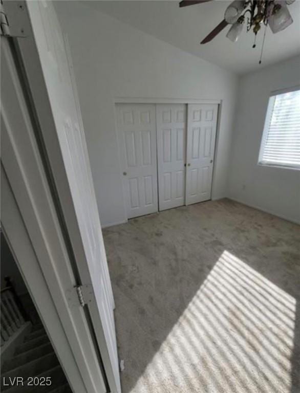 7879 Villa Pintura Ave, Las Vegas, NV 89131 - unfurnished bedroom with carpet flooring, lofted ceiling, a closet, and a ceiling fan