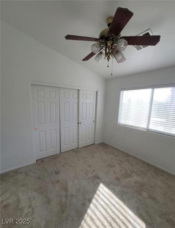 7879 Villa Pintura Ave, Las Vegas, NV 89131 - unfurnished bedroom featuring carpet floors, lofted ceiling, a closet, and a ceiling fan