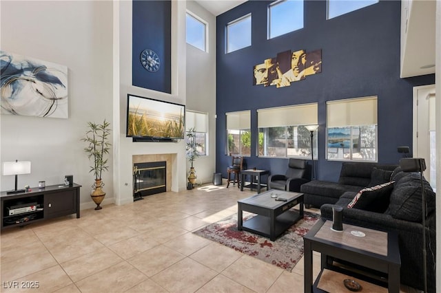 217 Turkey Creek Way, Henderson, NV 89074 - living room featuring a high ceiling, tile patterned flooring, and a tile fireplace