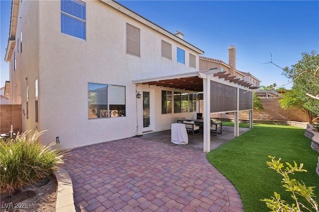 217 Turkey Creek Way, Henderson, NV 89074 - rear view of house featuring a pergola, a fenced backyard, stucco siding, and a patio area