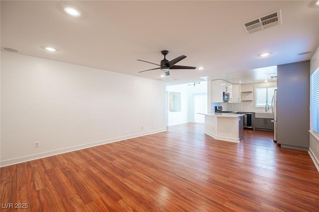 7388 Agonis St, Las Vegas, NV 89113 - unfurnished living room featuring wood finished floors, a ceiling fan, and recessed lighting