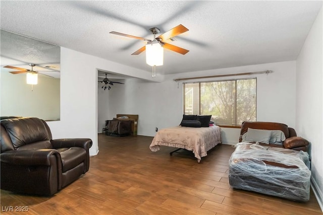 9109 Anchor Cove Ct, Las Vegas, NV 89117 - bedroom with wood finished floors, a textured ceiling, and ceiling fan