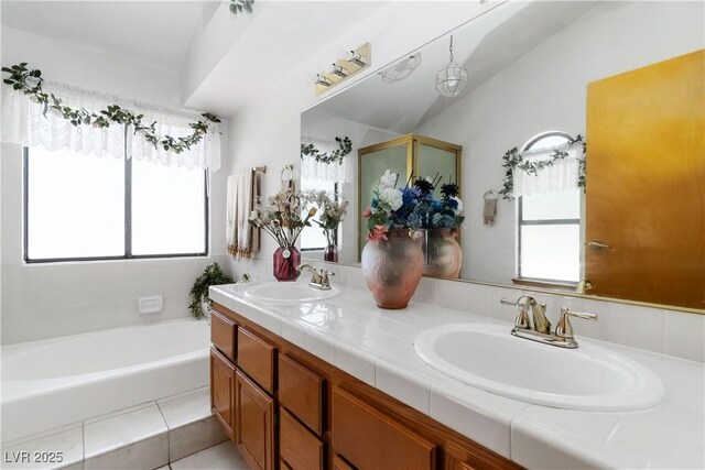 9109 Anchor Cove Ct, Las Vegas, NV 89117 - bathroom featuring double vanity, a garden tub, and tile patterned flooring