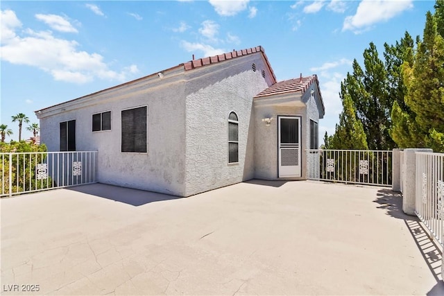 9109 Anchor Cove Ct, Las Vegas, NV 89117 - back of property featuring stucco siding and a patio area