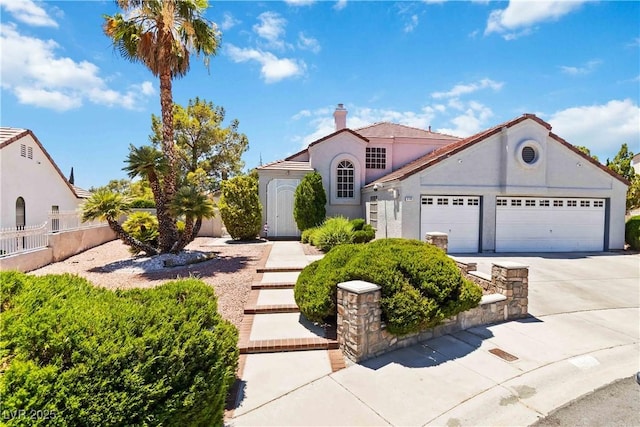 9109 Anchor Cove Ct, Las Vegas, NV 89117 - mediterranean / spanish-style house featuring a garage, concrete driveway, and stucco siding