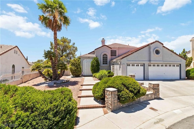 9109 Anchor Cove Ct, Las Vegas, NV 89117 - mediterranean / spanish-style house featuring a garage, concrete driveway, and stucco siding