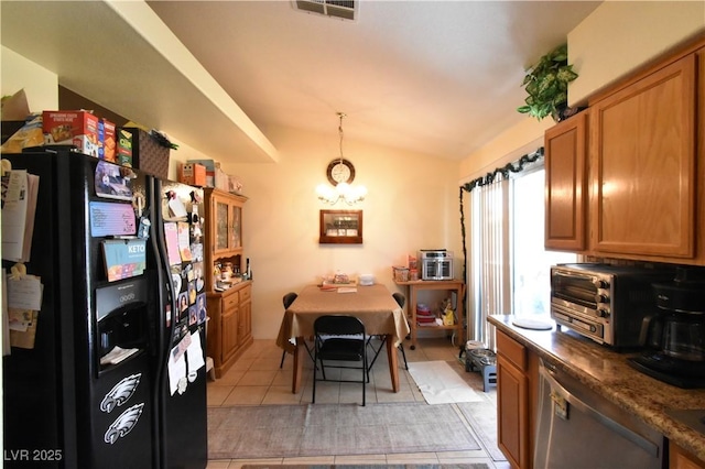 5105 Wildroot Rd, Las Vegas, NV 89130 - dining space featuring vaulted ceiling, light tile patterned floors, and a chandelier