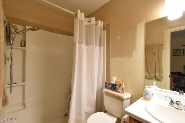 5105 Wildroot Rd, Las Vegas, NV 89130 - bathroom with a shower with curtain, a textured wall, and vanity